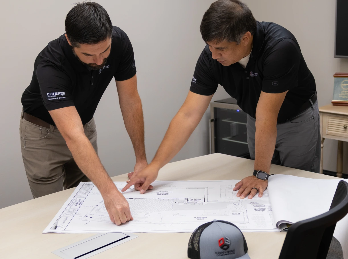 DBC team reading the blueprint